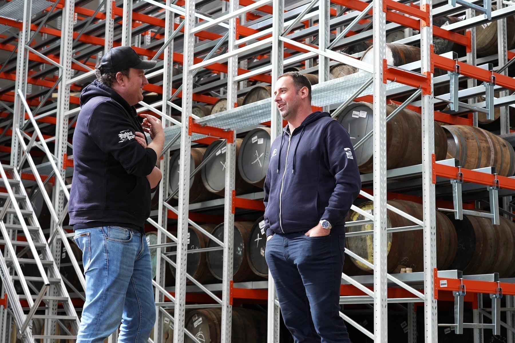 experts discussing whisky storage in a bonded warehouse